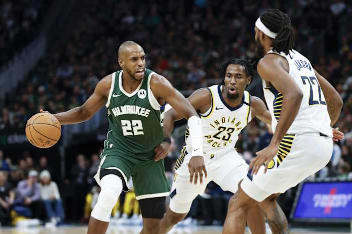 Milwaukee Bucks forward Khris Middleton (22) drives to the basket against Indiana Pacers forward Isaiah Jackson (22)